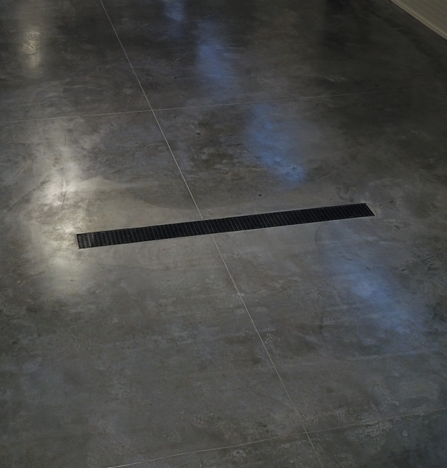 Concrete floor surface hardener